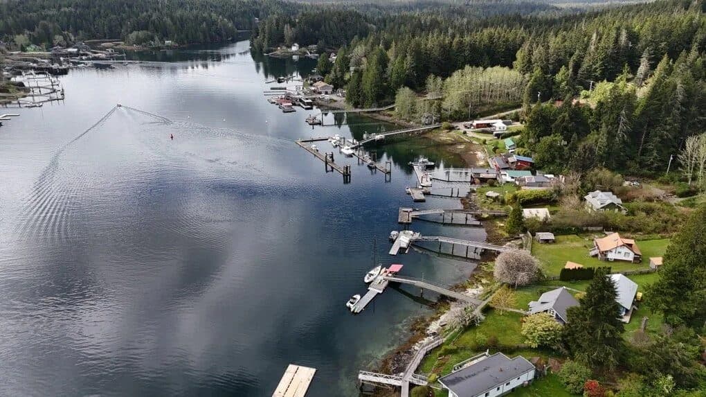 Aerial view of Bamfield Inlet, its private docks and boat-access-only waterfront homes on Vancouver Island